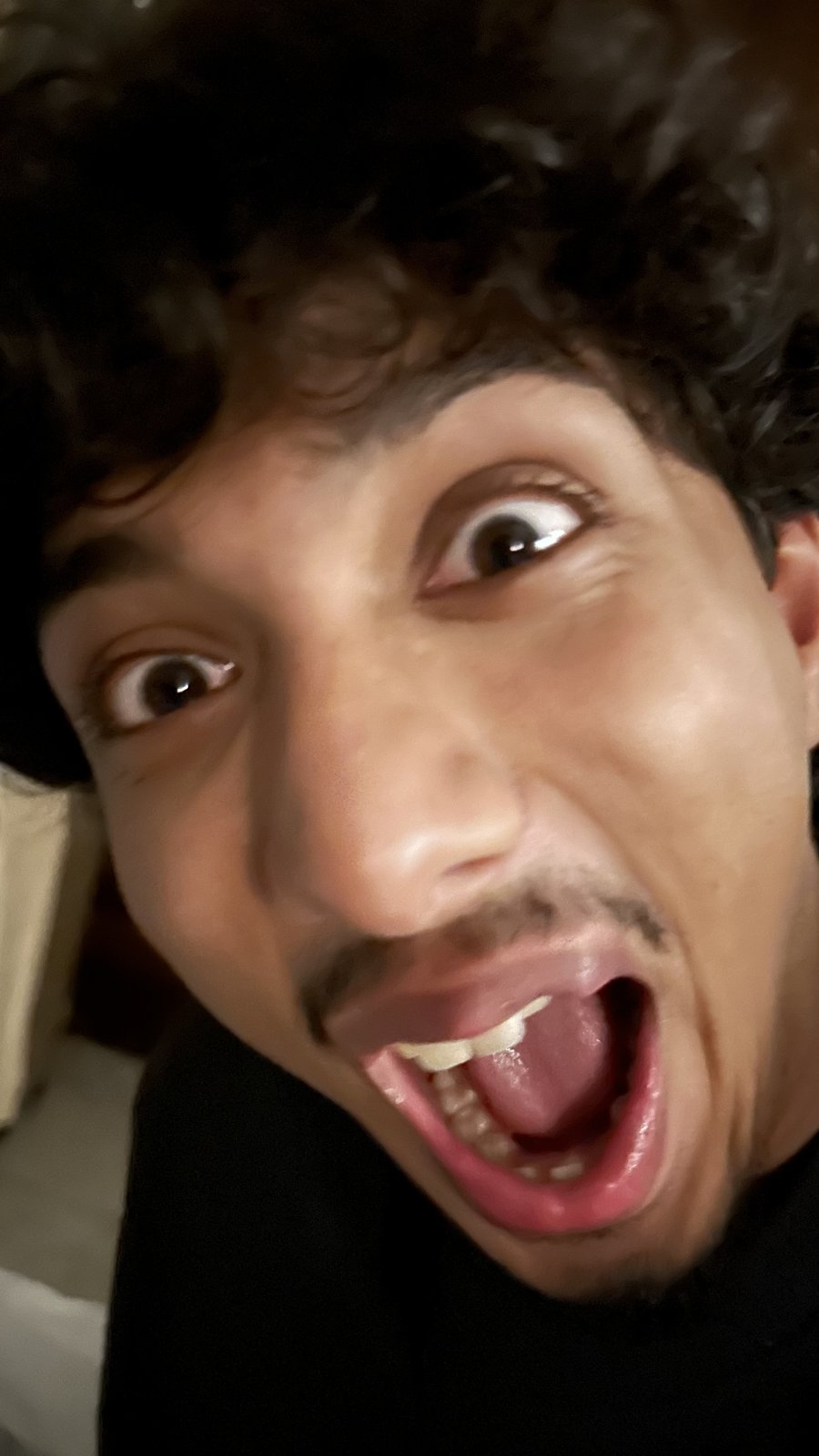 Krish Thakker making a wide-eyed face at the camera