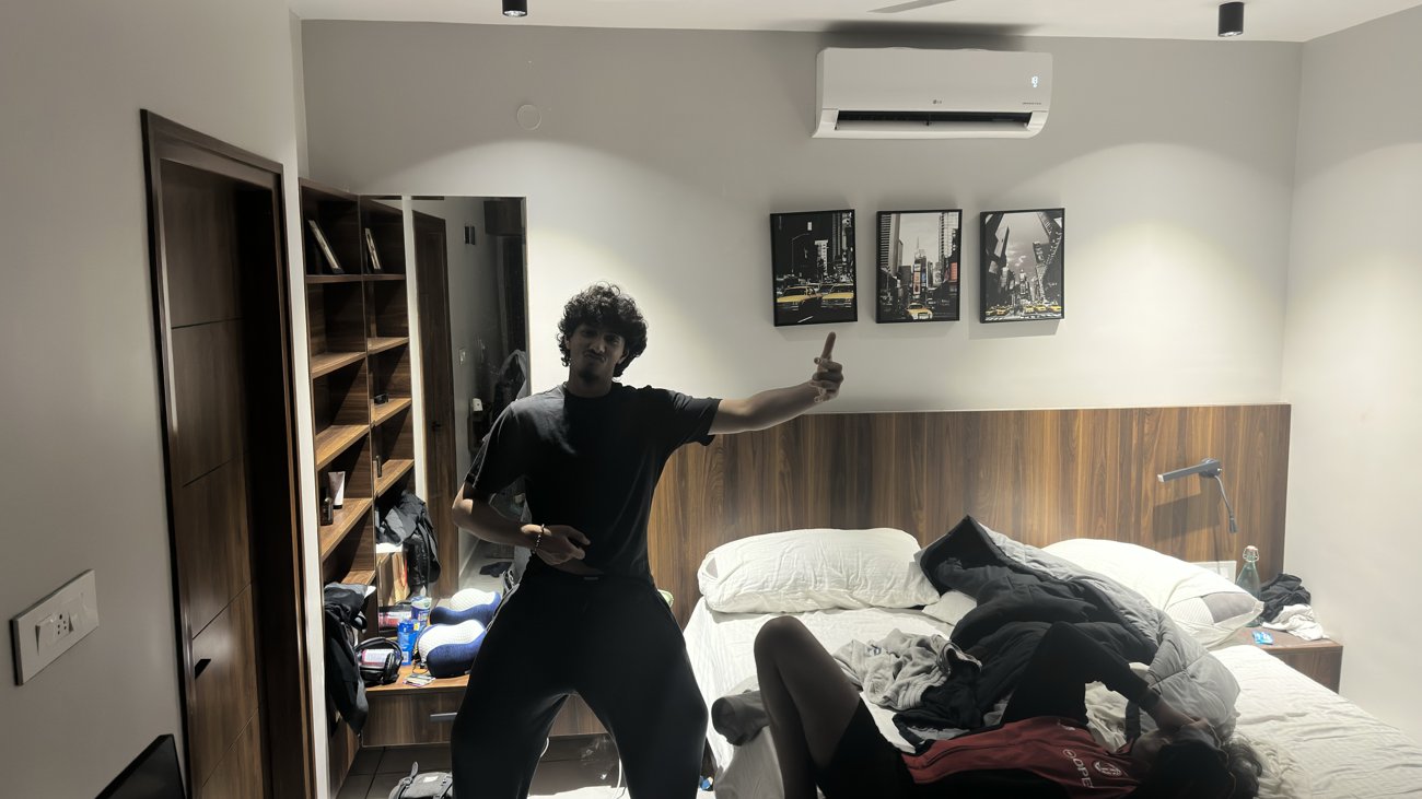 Krish Thakker posing with his arms out